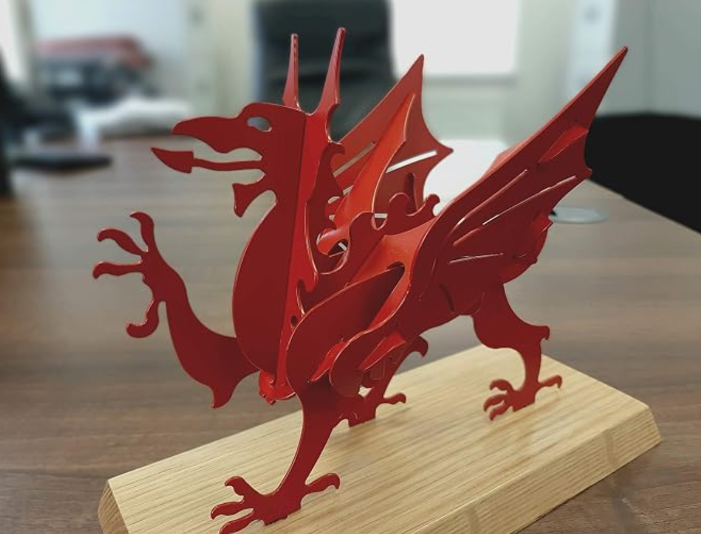 Red dragon trophy on plinth